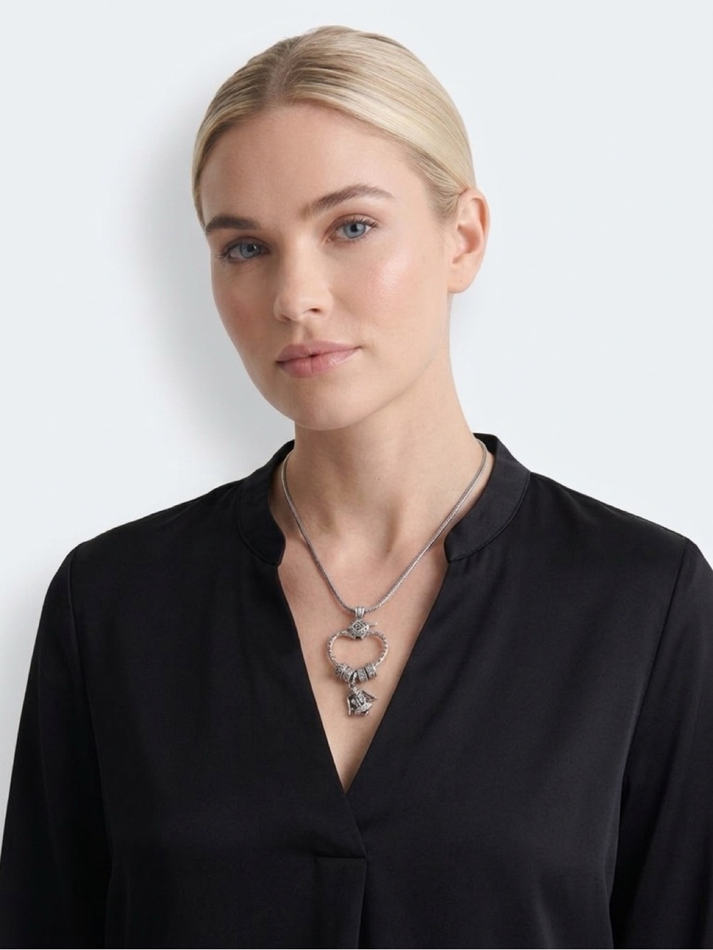 Brighton "Squeeze My Heart" charm holder necklace featuring an angel charm.